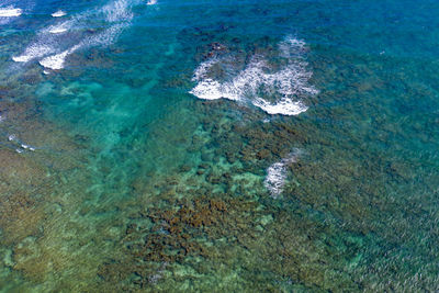 High angle view of rocks in sea