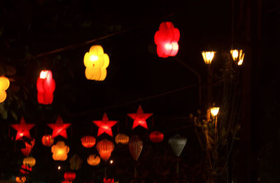 Illuminated lanterns hanging at night