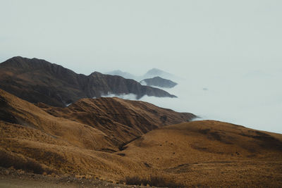 Road through the mountains and clouds