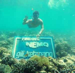 Full length of man swimming in sea