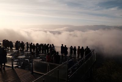 People standing against sky