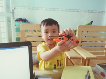 Cute boy playing at home