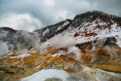 Scenic view of mountain range against sky