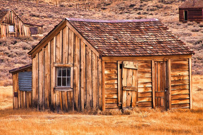 Old wooden house on landscape