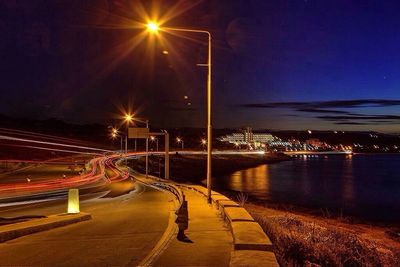 Illuminated street light at night