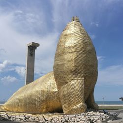 Low angle view of statue against sky