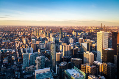 Aerial view of cityscape against sky during sunset