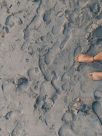High angle view of woman on sand at beach