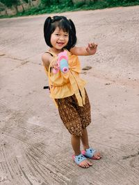 Portrait of happy girl on land