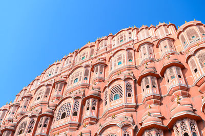 Low angle view of historical building against clear blue sky