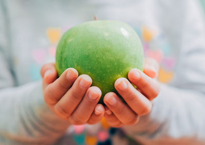 Close-up of hand holding fruit