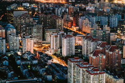 High angle view of illuminated buildings in city