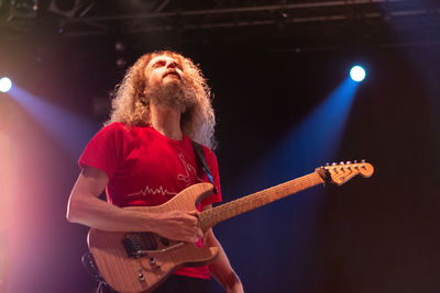 Full length of woman with guitar