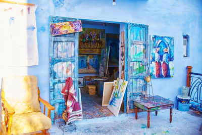 Graffiti on table and chairs in building