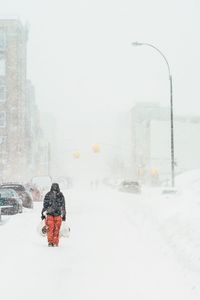 People standing on snow covered landscape