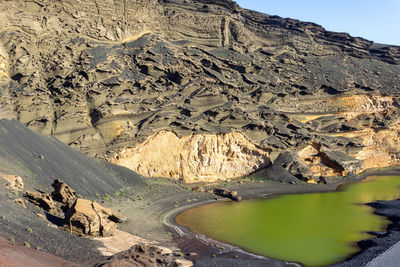 Lagoon with green water - lago verde - nearby el golfo on canary island lanzarote, spain