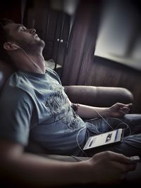 Low section of people sitting on tiled floor