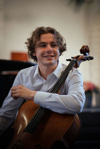 Portrait of man playing cello 