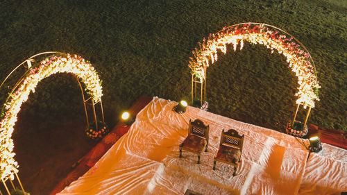 High angle view of illuminated lights at night