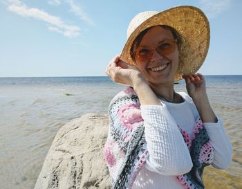 Portrait of a smiling young woman on beach