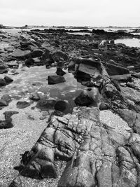 High angle view of rocks on beach against sky