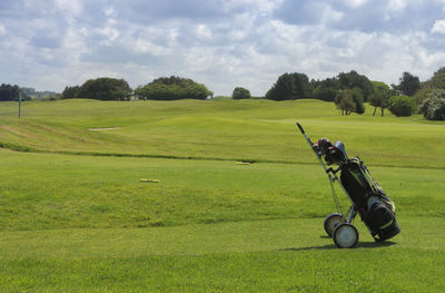 High angle view of golf course on field against sky