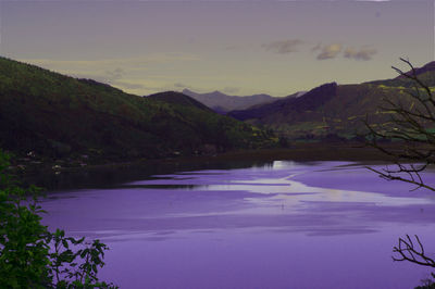 Scenic view of lake against sky during sunset