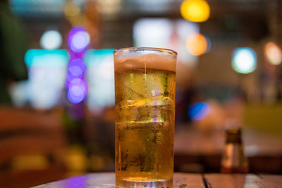 Close-up of beer glass on table