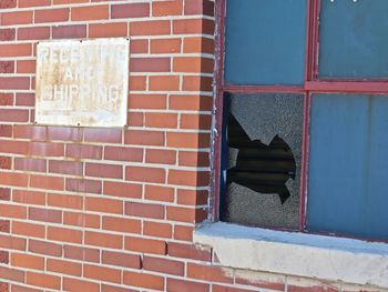 Close-up of window on brick wall