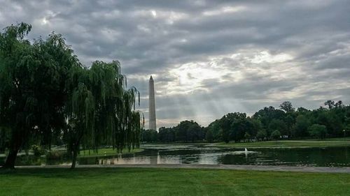 Scenic view of landscape against cloudy sky