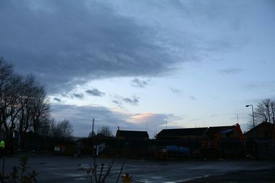 Built structure against cloudy sky at sunset