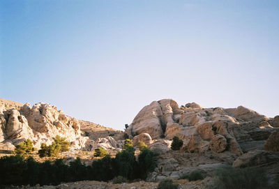 View of rocky mountain against clear blue sky