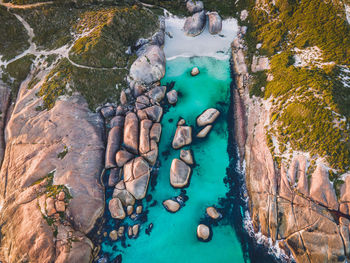 High angle view of rocks by sea