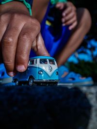 Close-up of baby playing with toy car