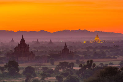 Panoramic view of temple against sky during sunset