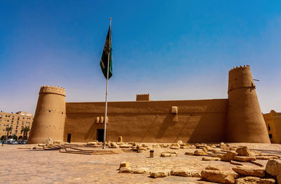 Old building against clear blue sky