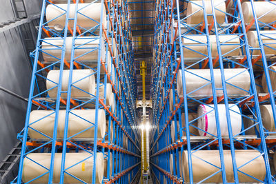 Low angle view of illuminated bridge in factory