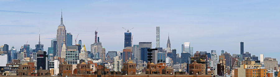 Modern buildings in city against sky