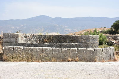 View of brick wall with mountain in background