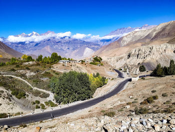 Scenic view of snowcapped mountains against blue sky