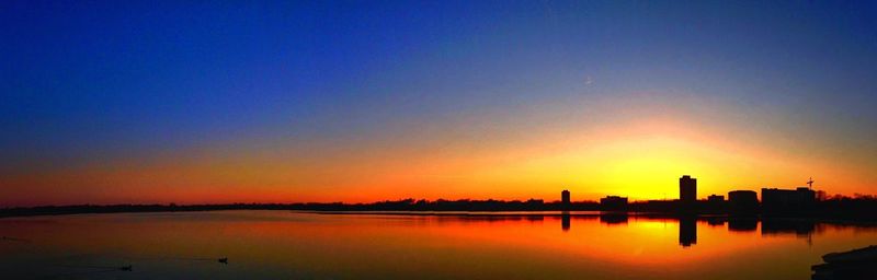 Scenic view of sunset over river