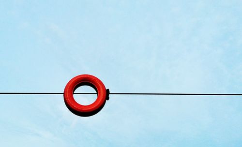 Low angle view of cables against clear blue sky