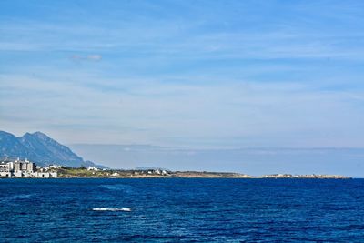 Scenic view of sea against blue sky