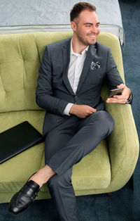 Businessman sitting on sofa