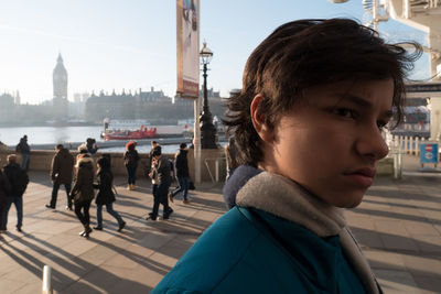 Portrait of man looking at city