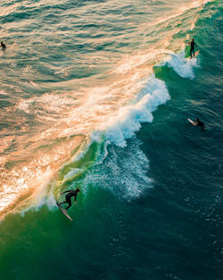 High angle view of people on sea shore