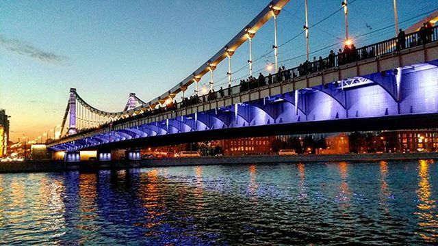 built structure, architecture, water, bridge - man made structure, waterfront, connection, river, sky, reflection, engineering, bridge, building exterior, blue, transportation, travel destinations, travel, outdoors, famous place, low angle view, clear sky