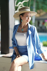 Young woman looking away outdoors