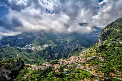 Scenic view of mountains against cloudy sky