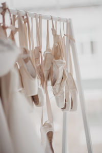 Close-up of dress and shoes for sale in market